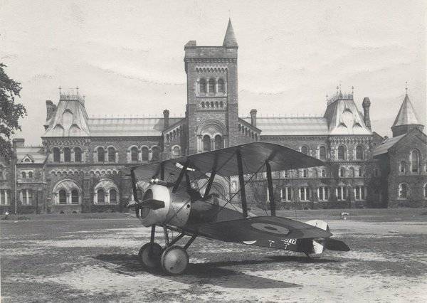 Airplane landed on grass in front of University College