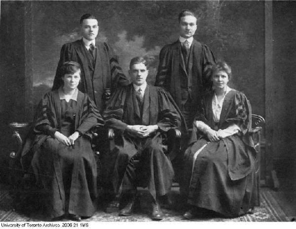 group portrait of three men and two women in academic robes