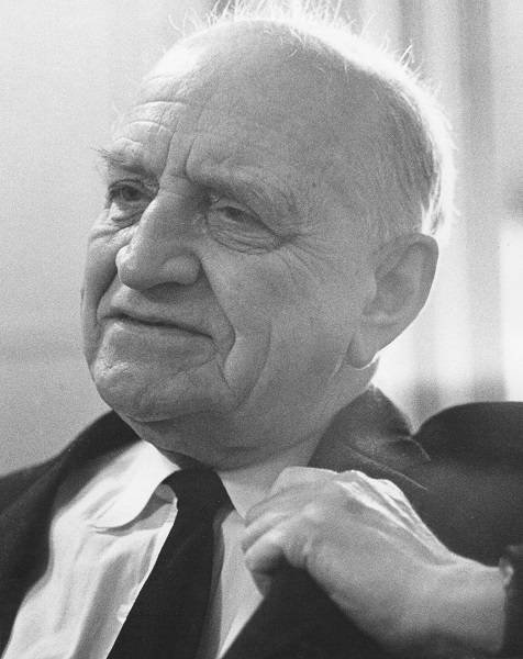 A.S.P. Woodhouse wearing a suit
