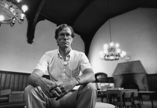 Professor David Rayside seated in Junior Common Room