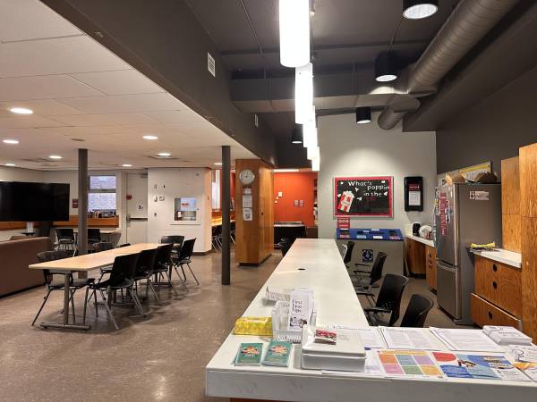 The picture showcases the vibrant community student center, a hub for learning, collaboration, and social activities. Its welcoming atmosphere invites students to connect and engage with one another.
