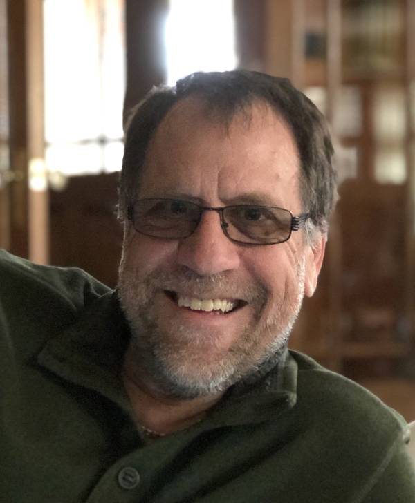 Smiling Photo of Professor John Vervaeke