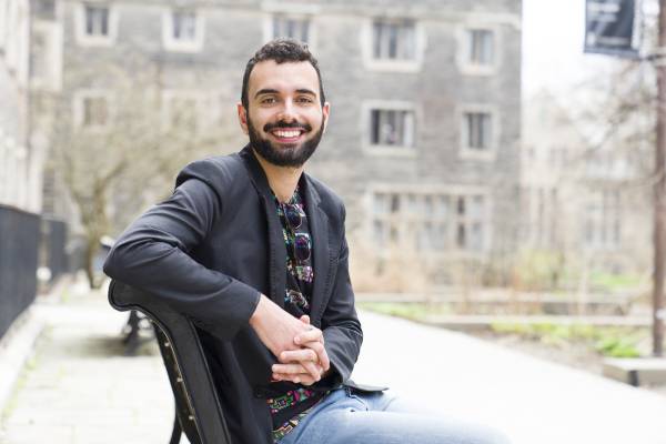 Photo of Paolo Frasca sitting on a bench