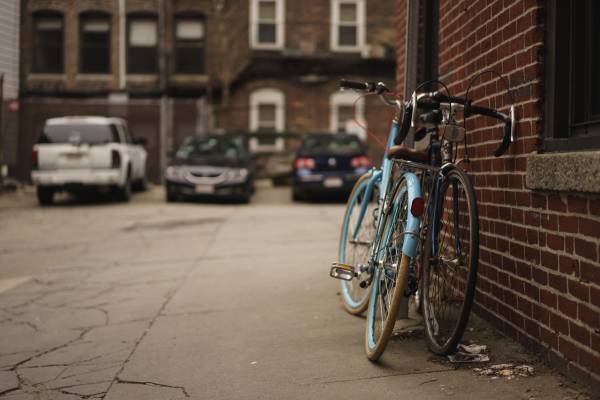 bicycles leaning on wall