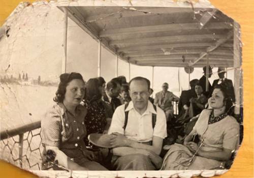 an old photograph of a group of people on a boat in the 1940s
