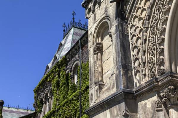 Side angle shot of the UC Building in Summer