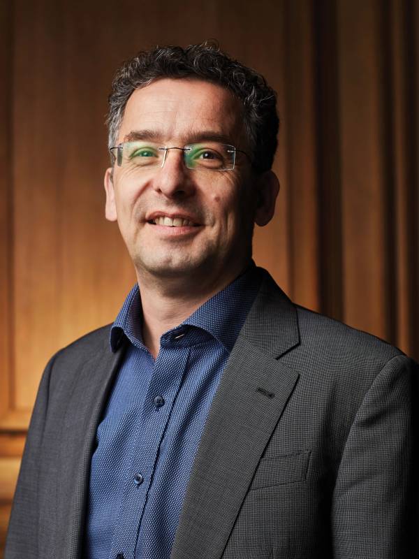 Smiling headshot of Professor Markus Stock, UC Principal