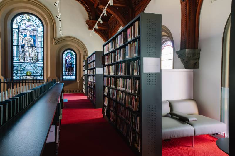 Shelves and study spaces in the revitalized UC library (formerly East Hall).