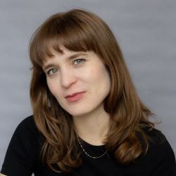 A picture of Nicole Dufoe in a black t-shirt.