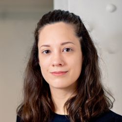 Karina Vold, wearing a black shirt, smiling at the camera.