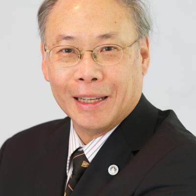 Portrait of B. Ralph Chou in a dark suit. He is smiling and wearing a small pin in his lapel.